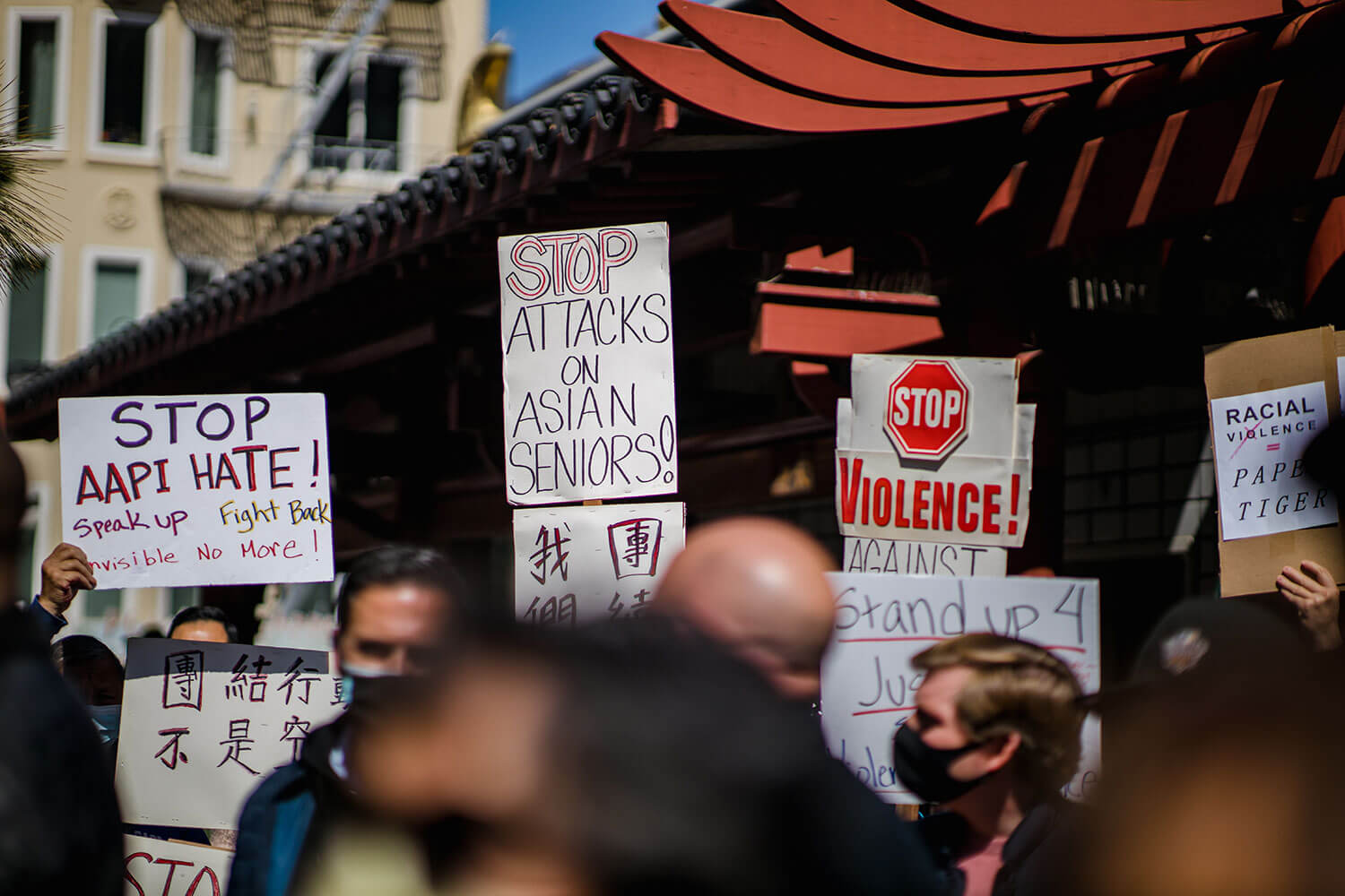 Signs that say "Stop AAPI Hate" and "Stop Attacks on Asian Seniors" at a recent protest