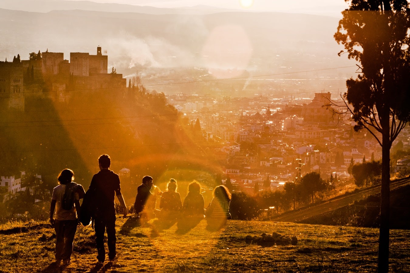 A group of people watching the sunset at Granada, Spain