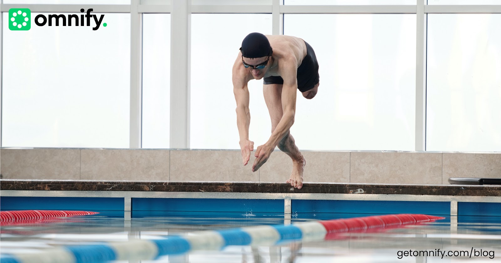 A physically disabled member diving in a pool