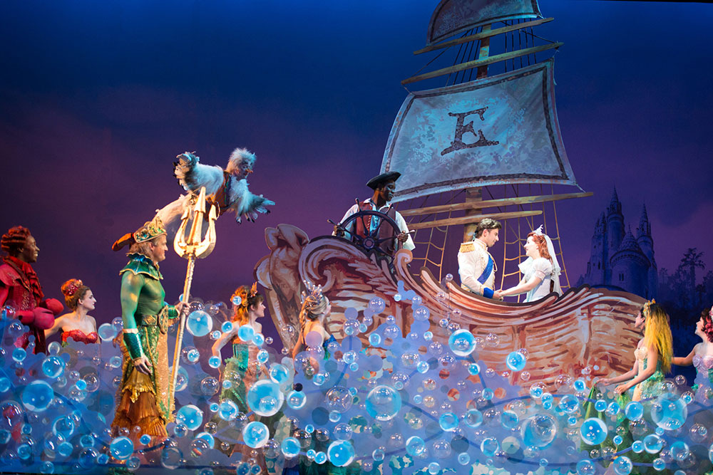 The illusion of being under the sea is created through light, sound, actors “swimming” up on wires and the movement of the actors themselves.