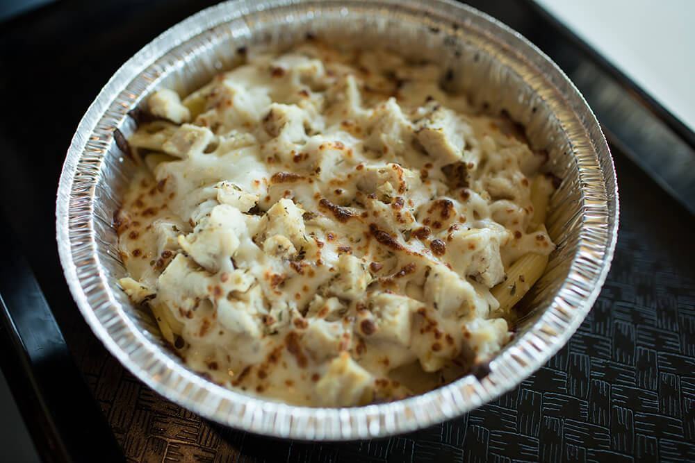 The chicken Alfredo is topped generously with white meat chicken, covered with creamy and flavorful Alfredo, sprinkled with cheese and nicely toasted before serving. (Photo: Valerie Grant)