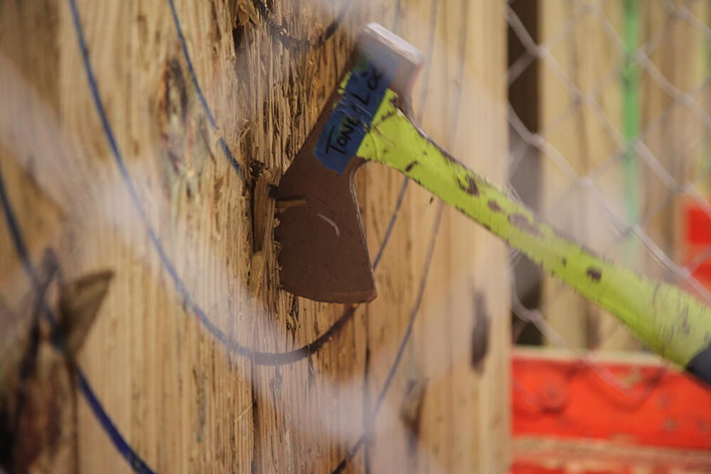 It may seem crazy that people would get together to toss axes at targets, while winding down from a hard day’s work over a couple beers, but doesn’t that sound a little like bowling alleys and pool halls back in the day? (Photo: Marc Rains)