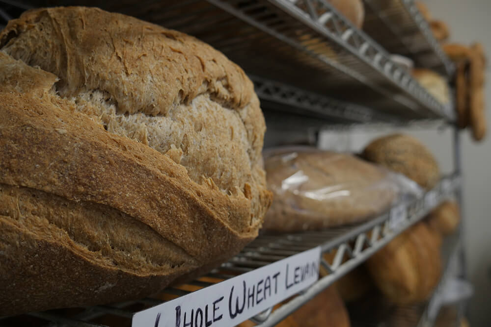 If you’ve never been inside Farrell Bread or haven’t been in lately, now’s a great time to visit. You can see for yourself the bright space and enjoy delicious breads renowned around town for their taste and their quality ingredients, great flours without fillers, additives or preservatives. (Photo: Marc Rains)