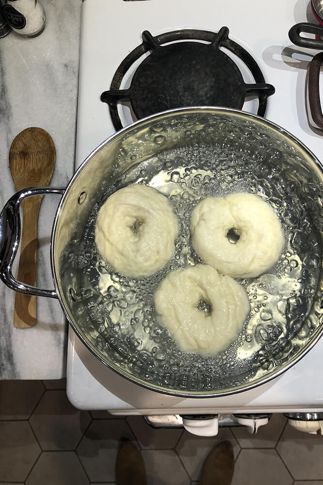 After rolling out the bagels, the next step was to boil them in a large stockpot for two minutes on each side (the longer the boil, the chewier they will be).