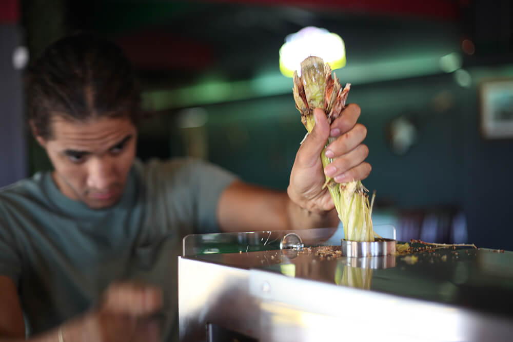 A station stocked with fresh-cut sugar cane sits near the entrance, where Miami Nights prepares an extra-special treat: sugar cane juice. (Photo: Marc Rains)
