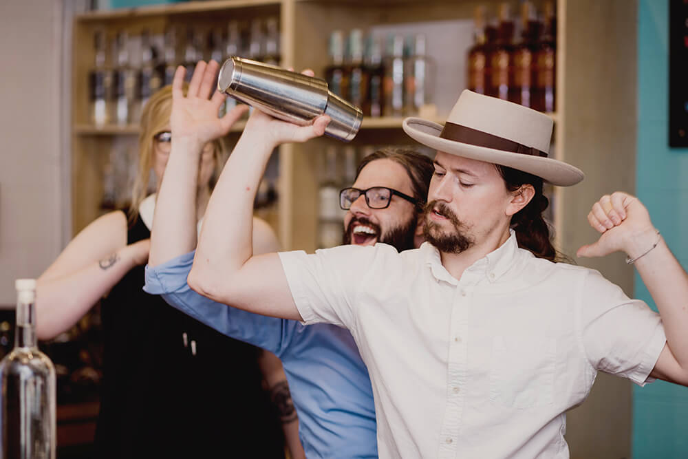 Hunter Gambill (center) and his Oklahoma Distilling Company crew love spending their days creating spirits. (Photo: Sarah Eliza Roberts)