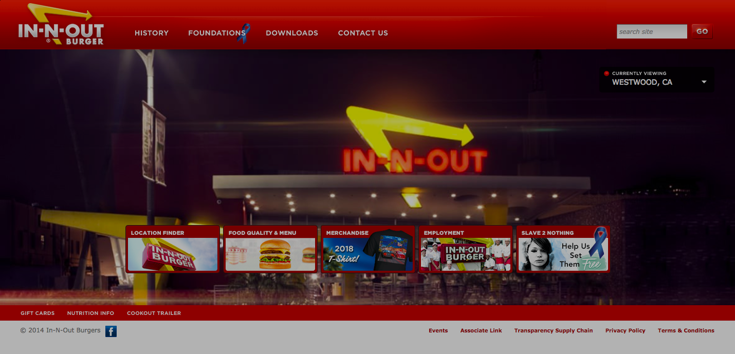 In-N-Out Burger's homepage showing the outside of their restaurant at night. The bright yellow and red neon lights grabbing our attention.
