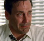 A close up of Don Draper crying.