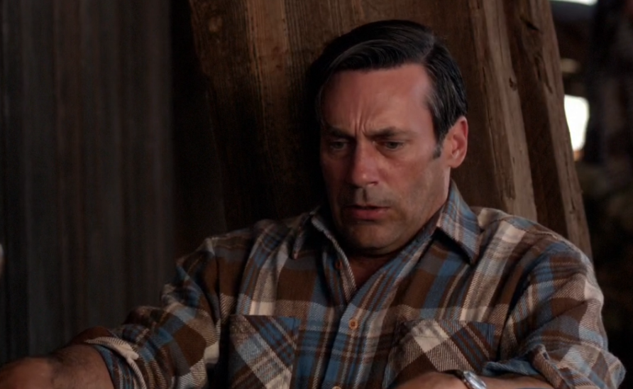 Don Draper in a flannel plaid shirt looking panicked.