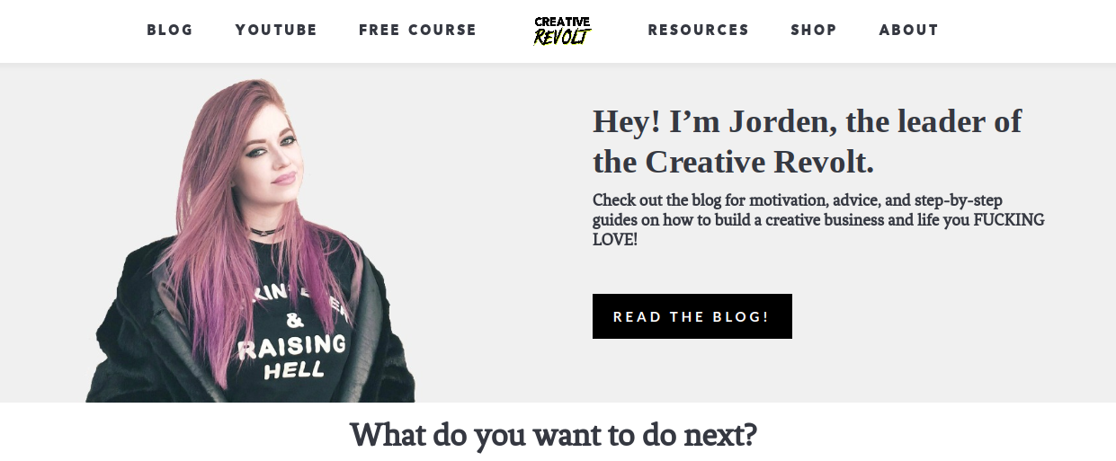 Jorden Roper with pink hair and black clothes on the left and her site copy and a CTA on the right