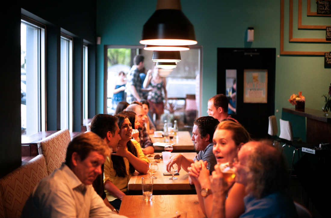 people eating and talking