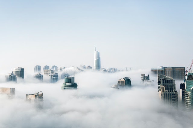 image of buildings in clouds
