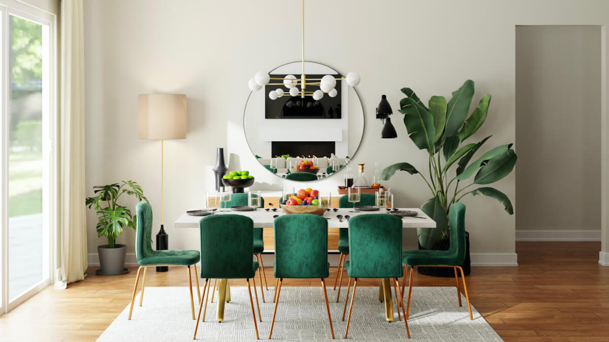 eight green chairs around a white table show the talent of an interior designer, who also added a round mirror and and big plants