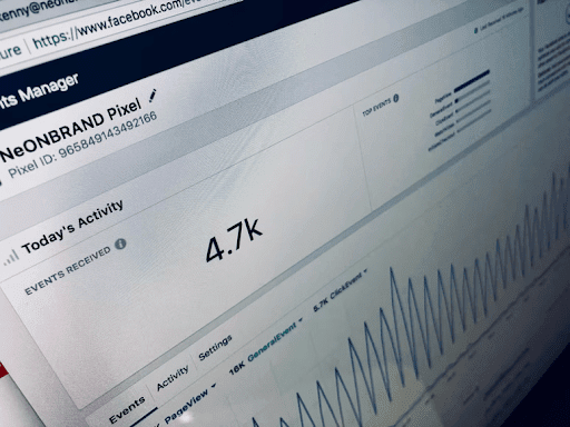 Facebook Insights report displayed on a laptop screen