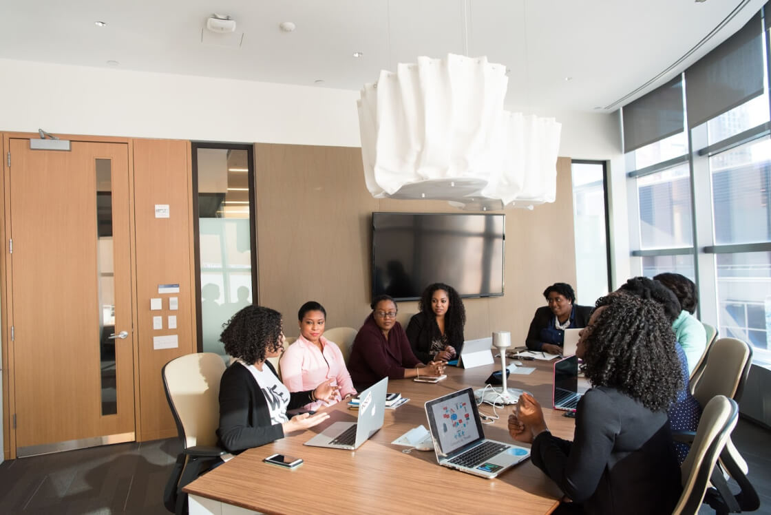 employees having a meeting in a conference room