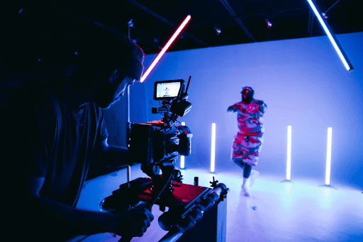 a videographer recording a video inside a studio