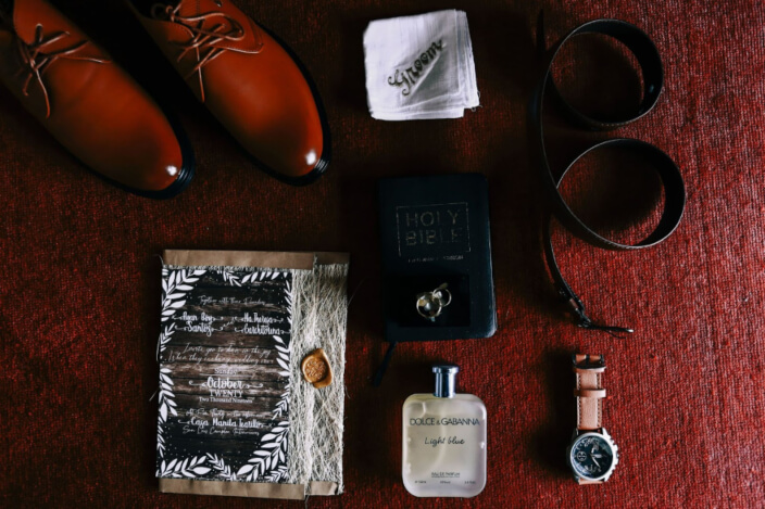flat lay of groom's accessories