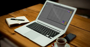 A MacBook sitting on a desk.
