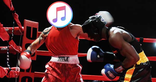 A boxer with an iTunes logo over his face, punching another boxer.