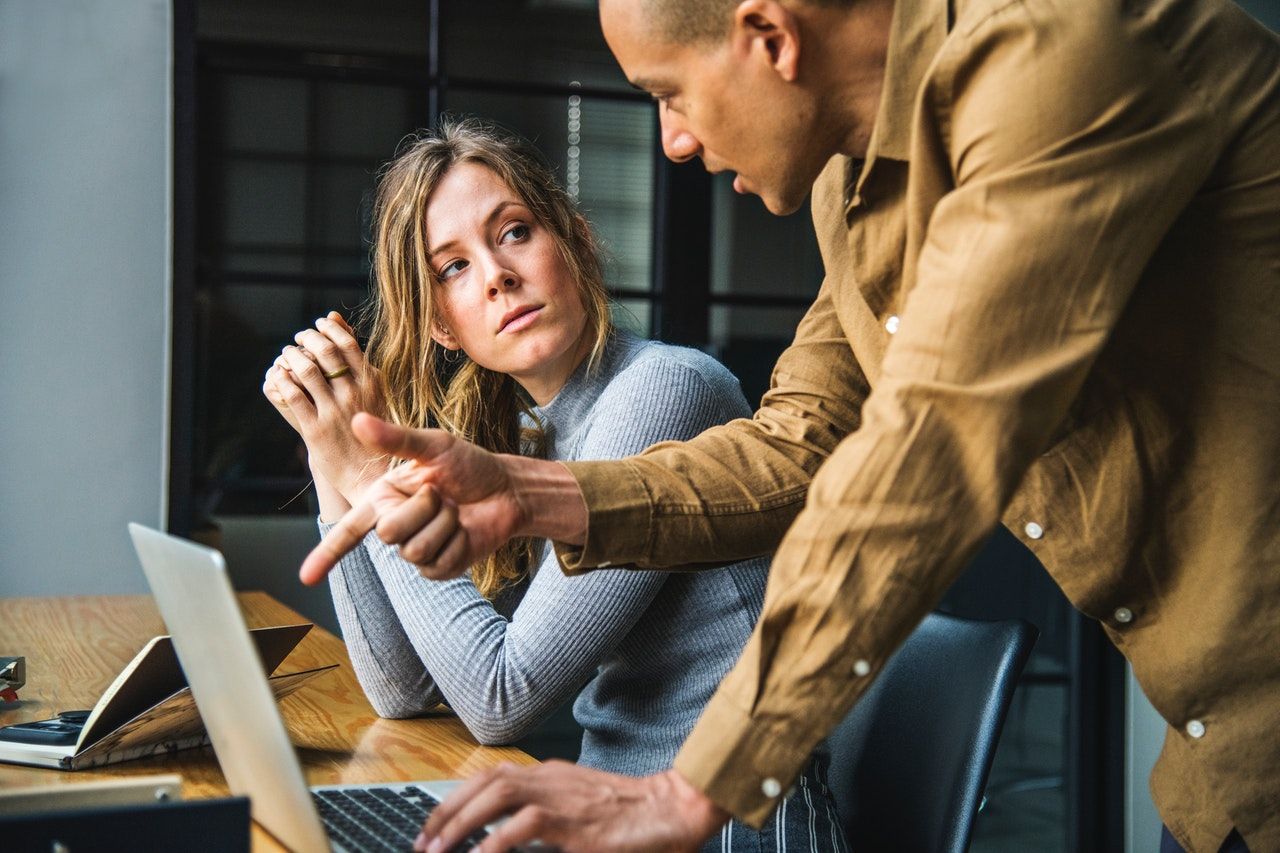 woman getting feedback from manager