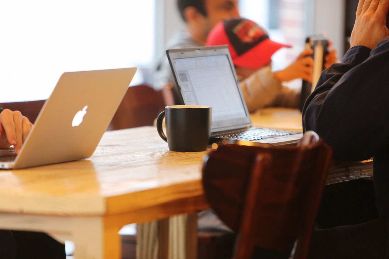 people working at a coffee shop