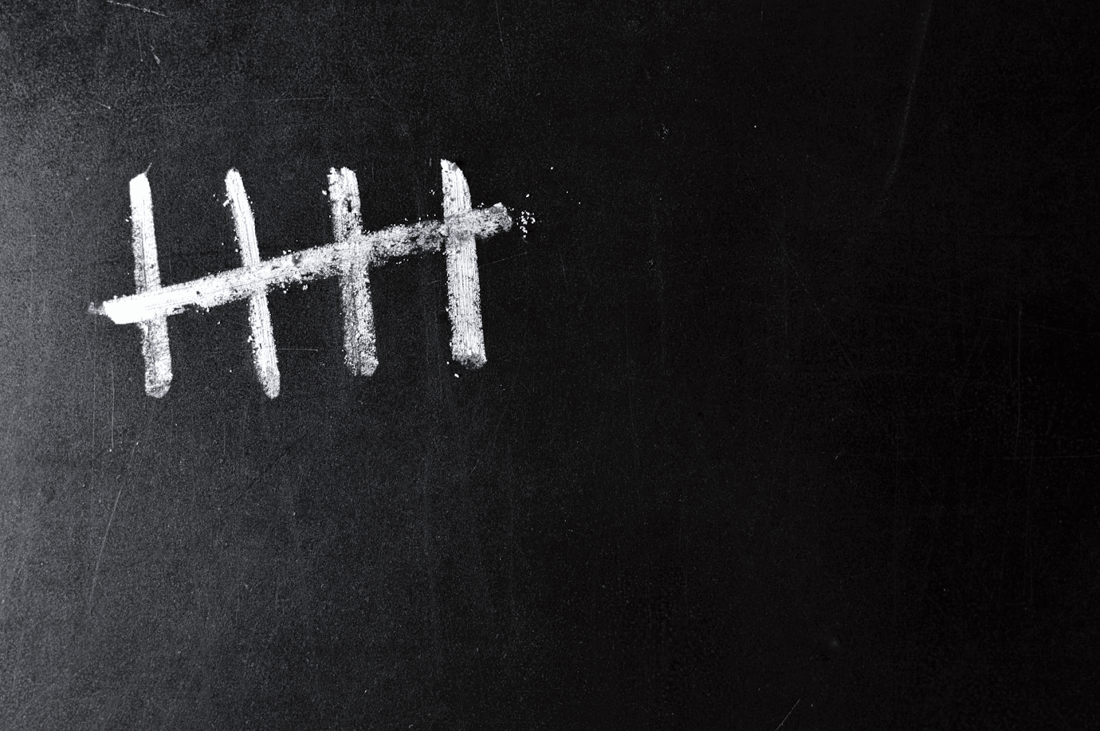 5 dashes on a chalkboard.
