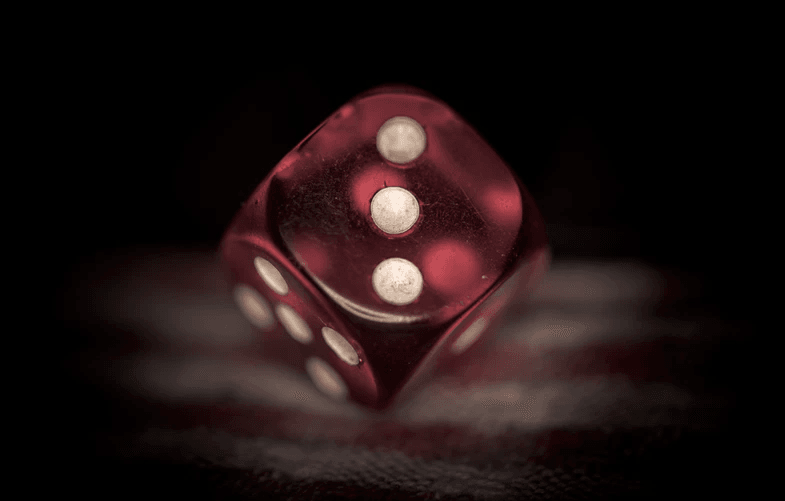 A red die set to the number three.