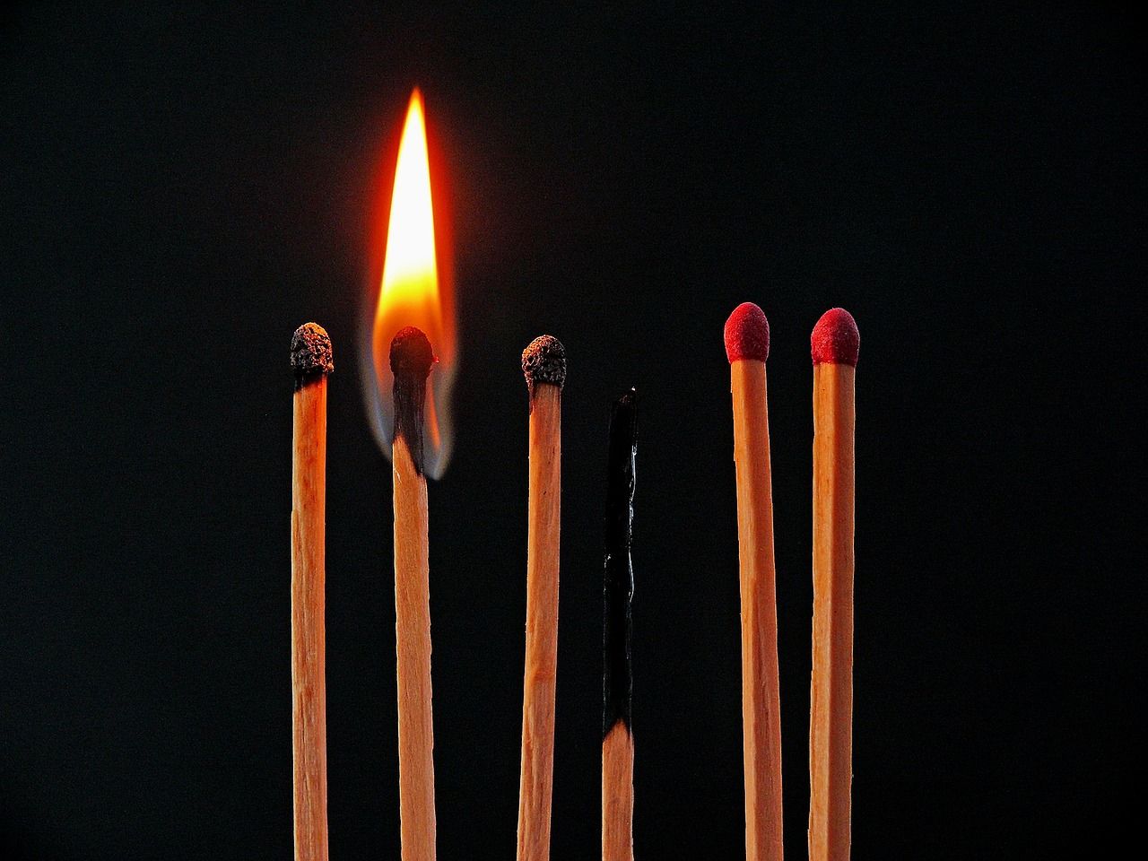 row of matches burning