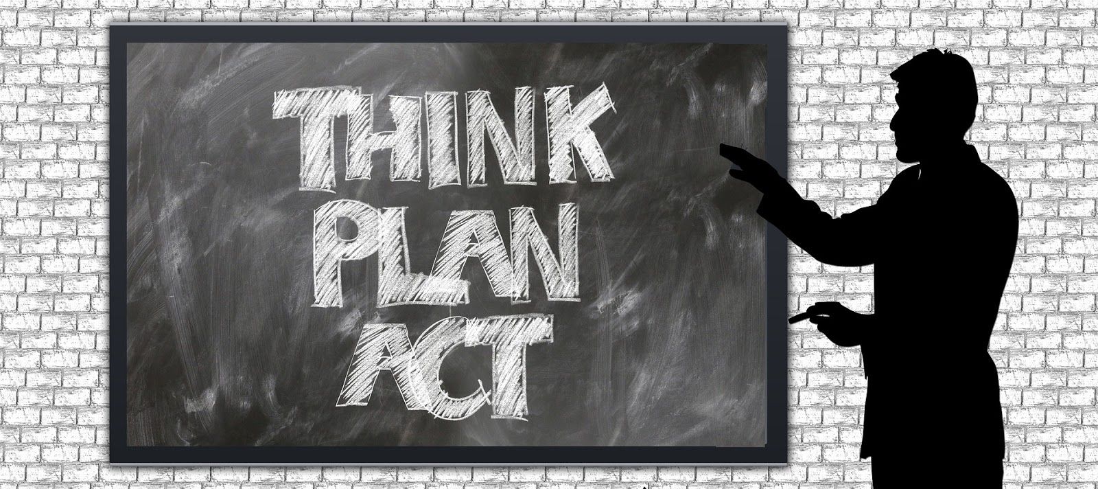 Silhouette of man pointing at chalkboard with words think plan act on it