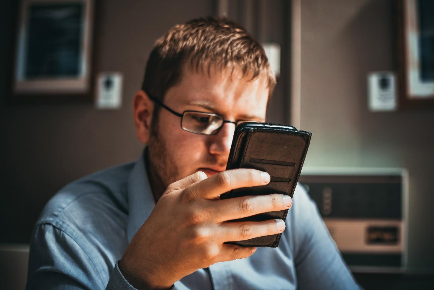 businessman looks at phone call