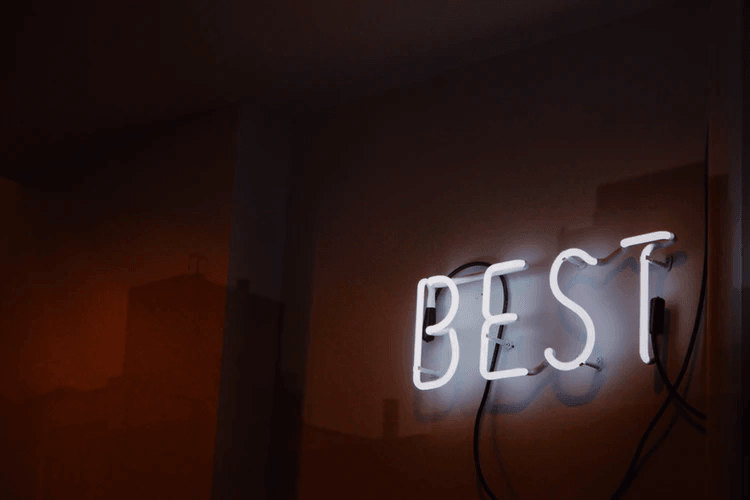 A white neon sign that says "Best".