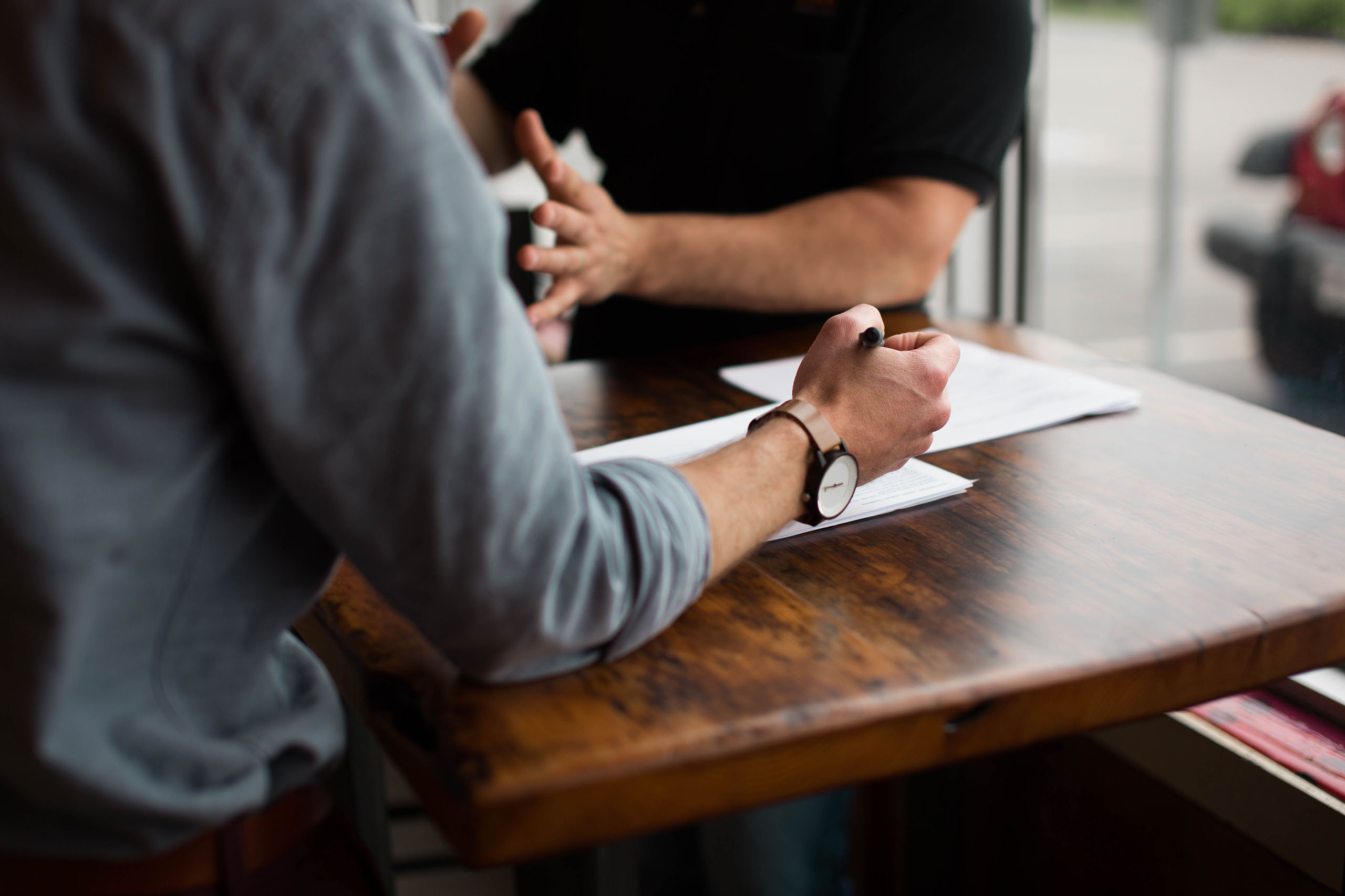 Conversation between two people at a table