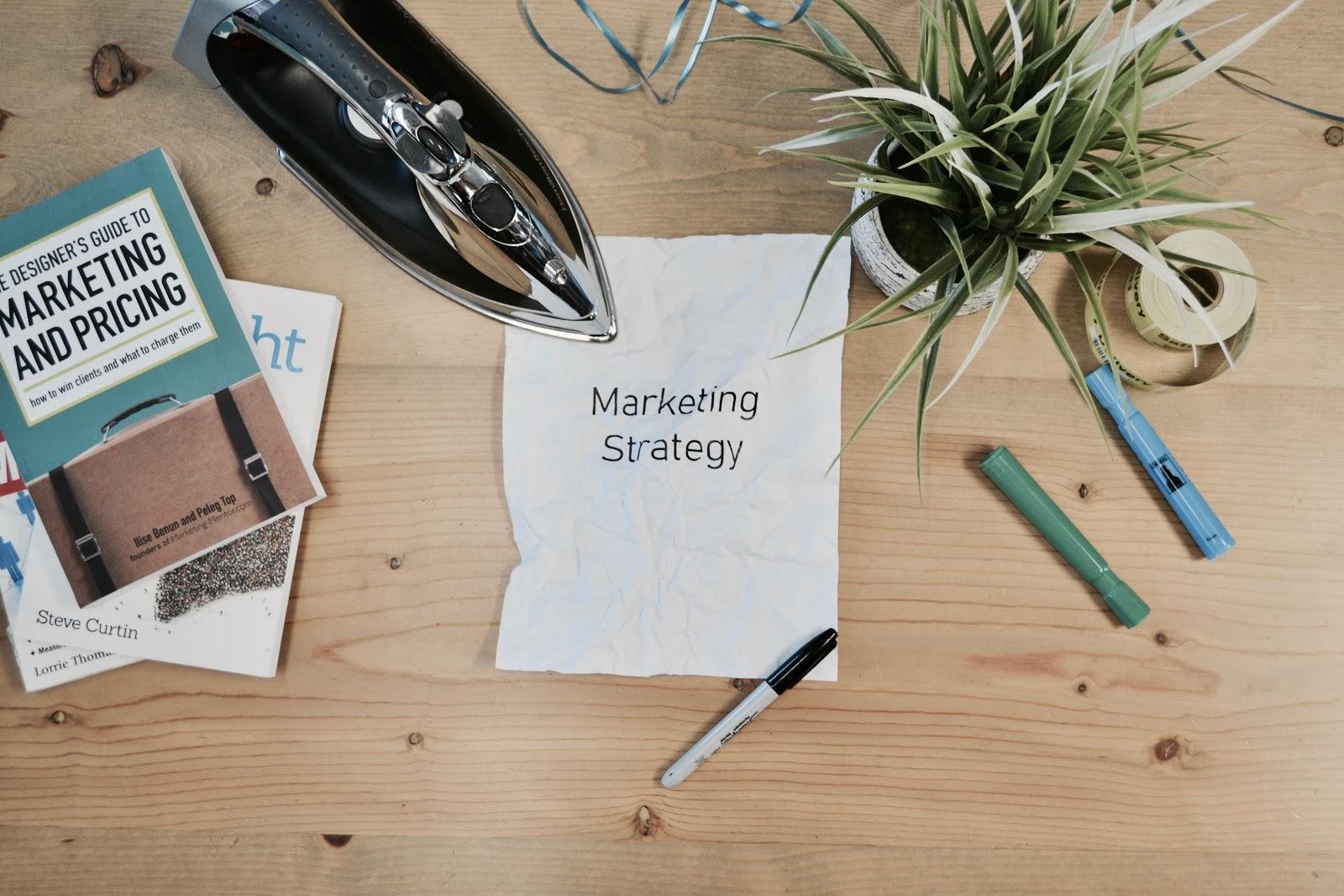 Marketing Strategy Written on Piece of Paper