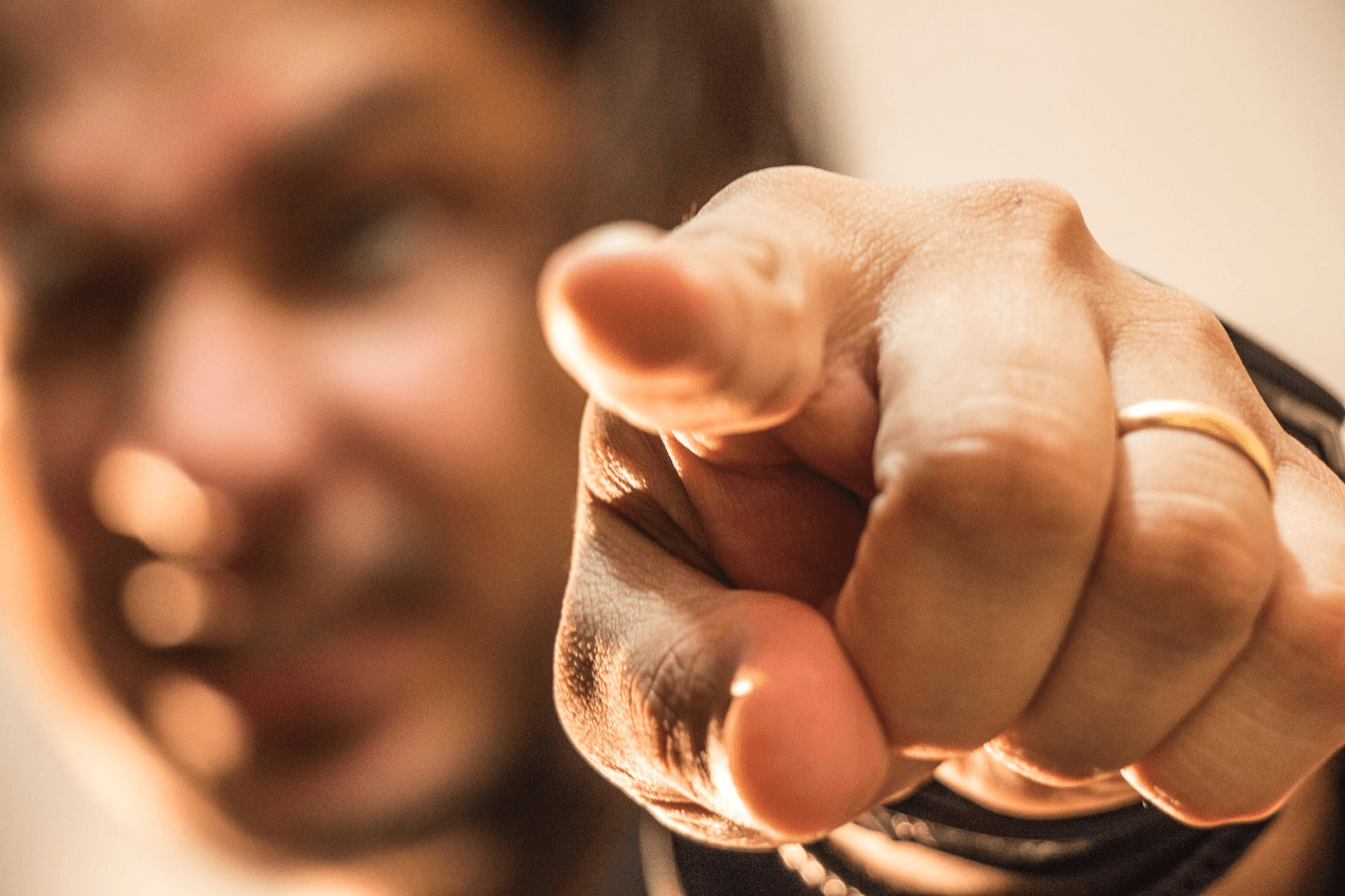 Man pointing at the camera.