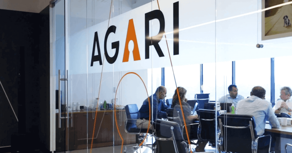 The Agari logo on a glass wall.