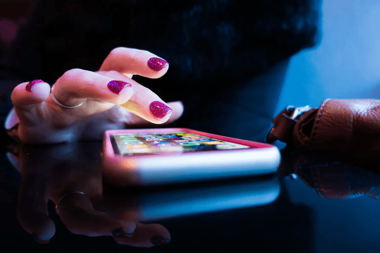 A woman using her iPhone.