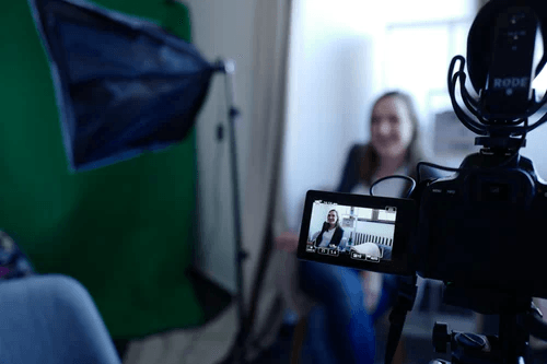 A woman recording her presentation.