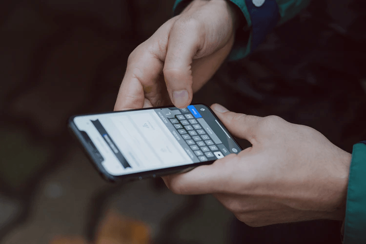 A person communicating with their mobile phone.