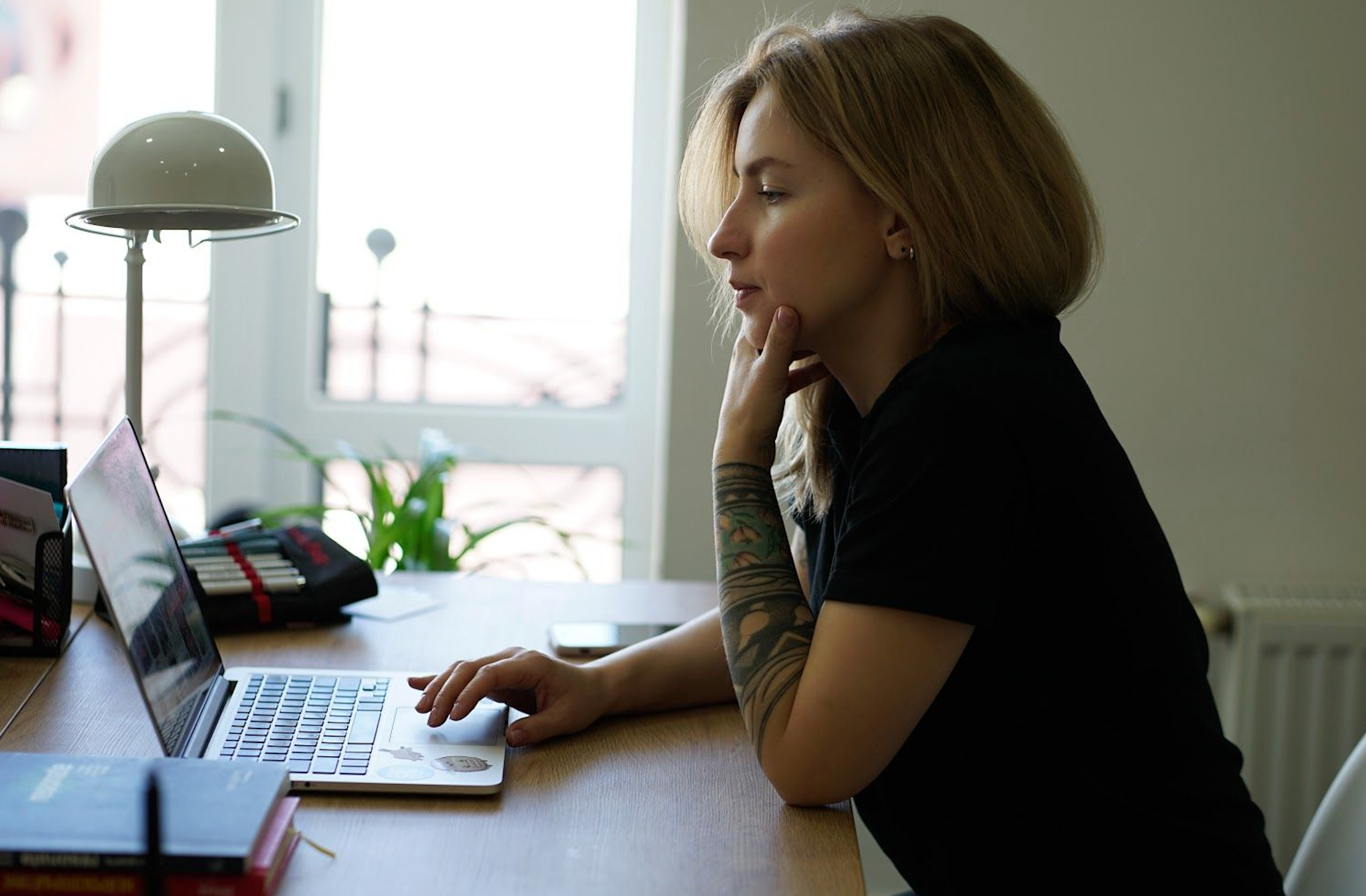 woman working remotely on laptop