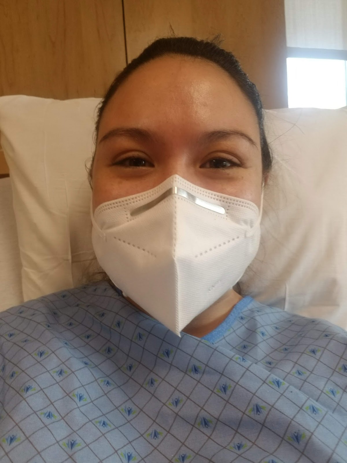 Maile Waite in a mask in the hospital