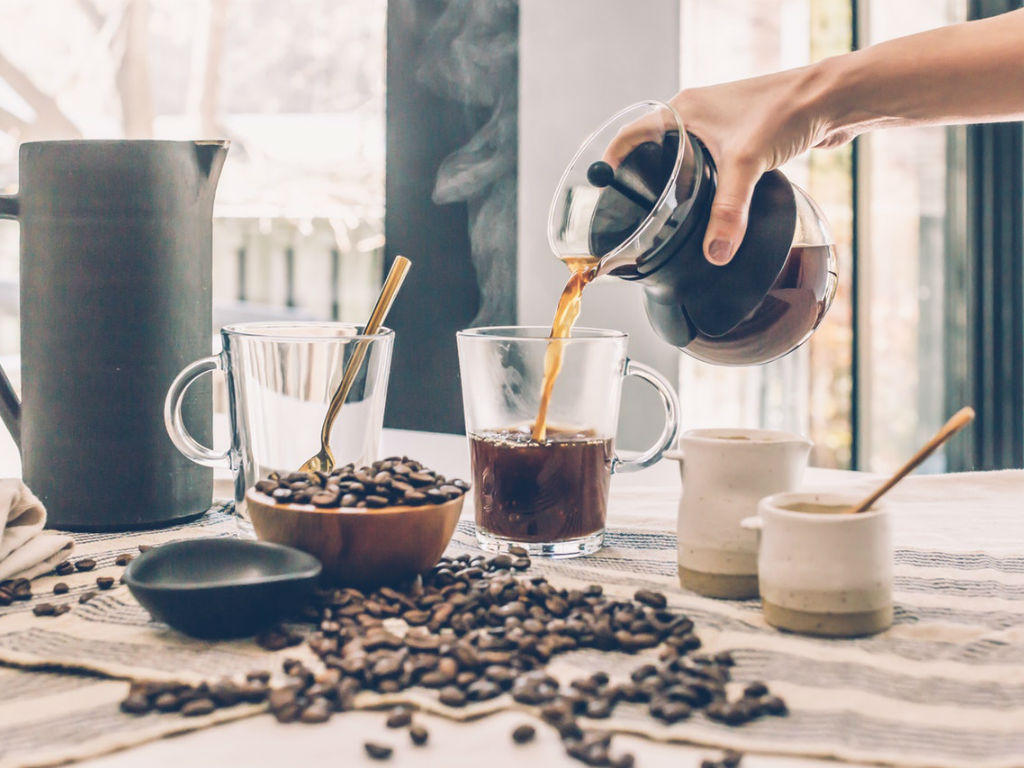 barista pouring coffee from a carafe