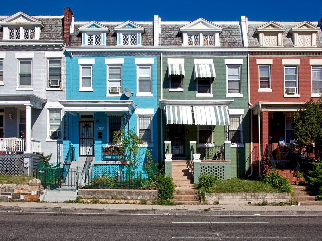 a row of colorful homes