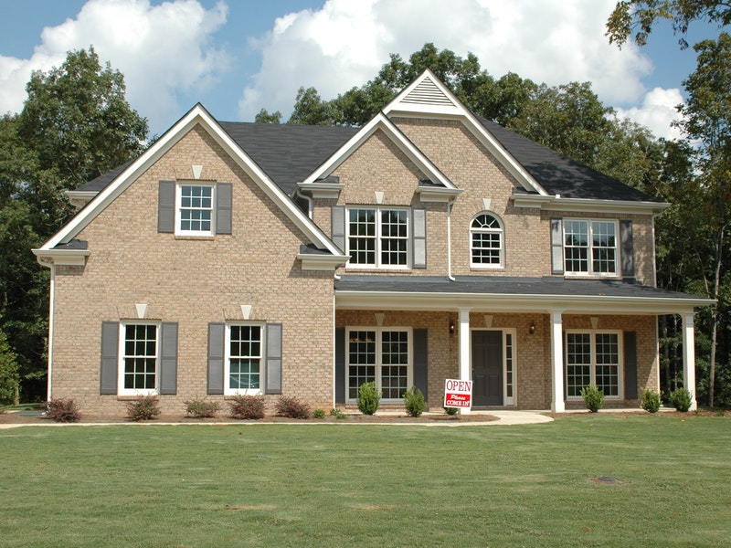 house with for open sign in front yard