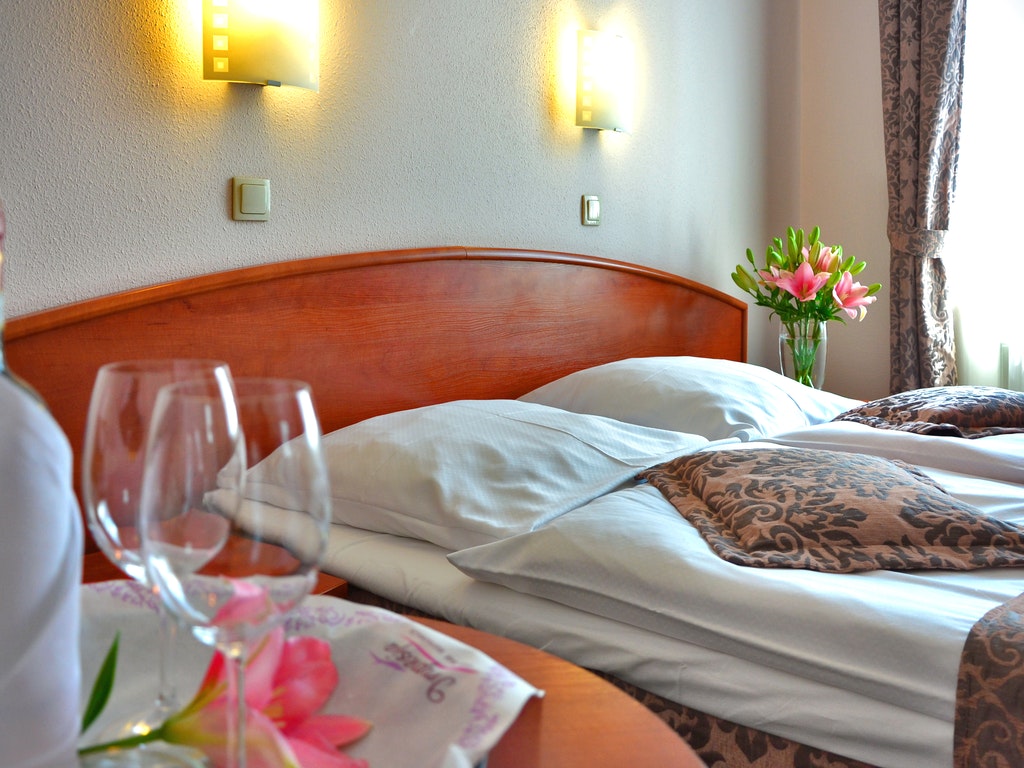 a hotel room with two champagne glasses