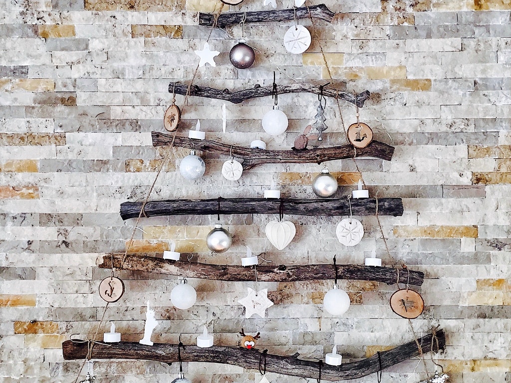 a minimalist christmas tree decoration on the wall