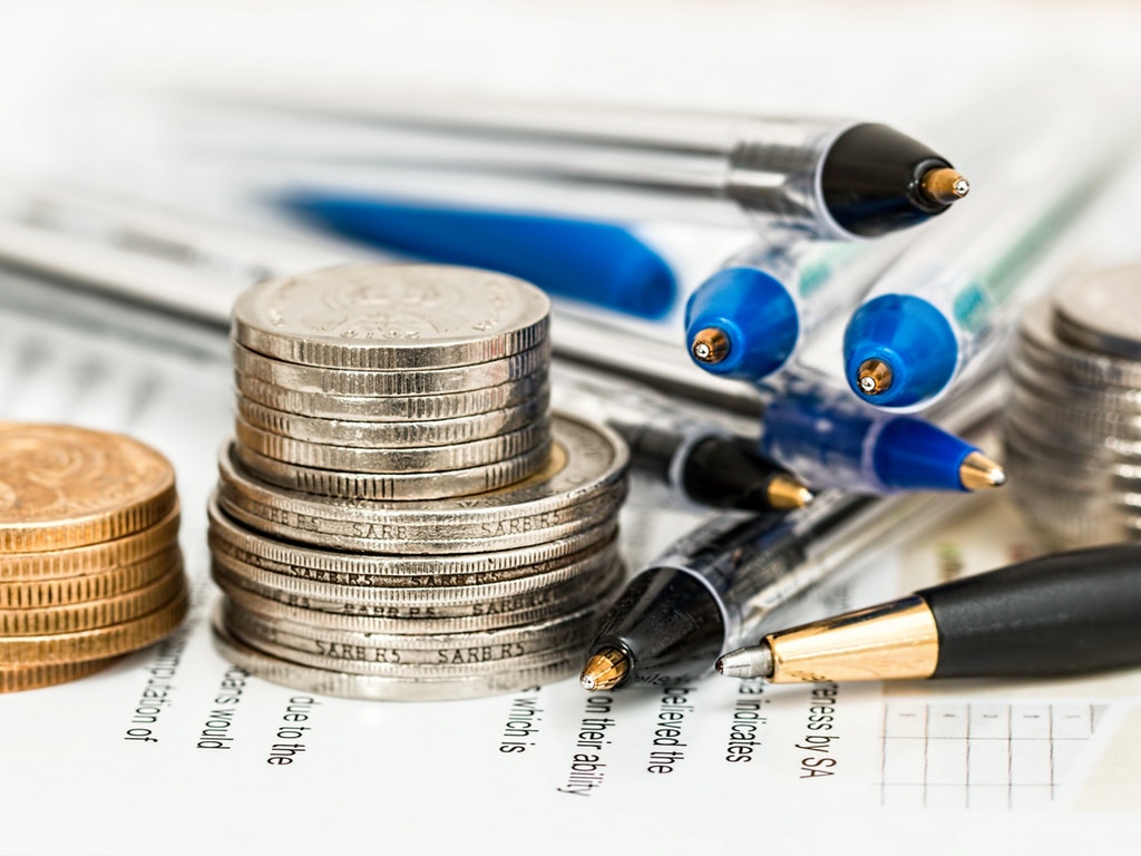 coins stacked on a contract