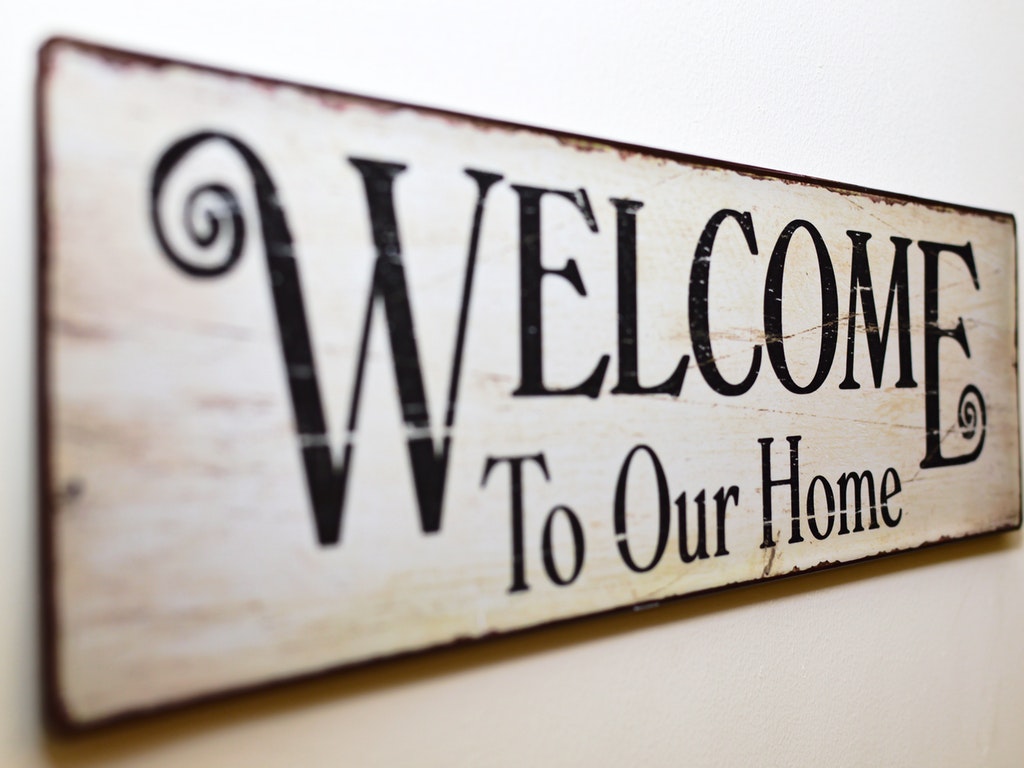 sign reading welcome to our home