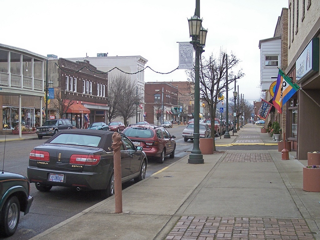 a street with cars parked along it in logan ohio