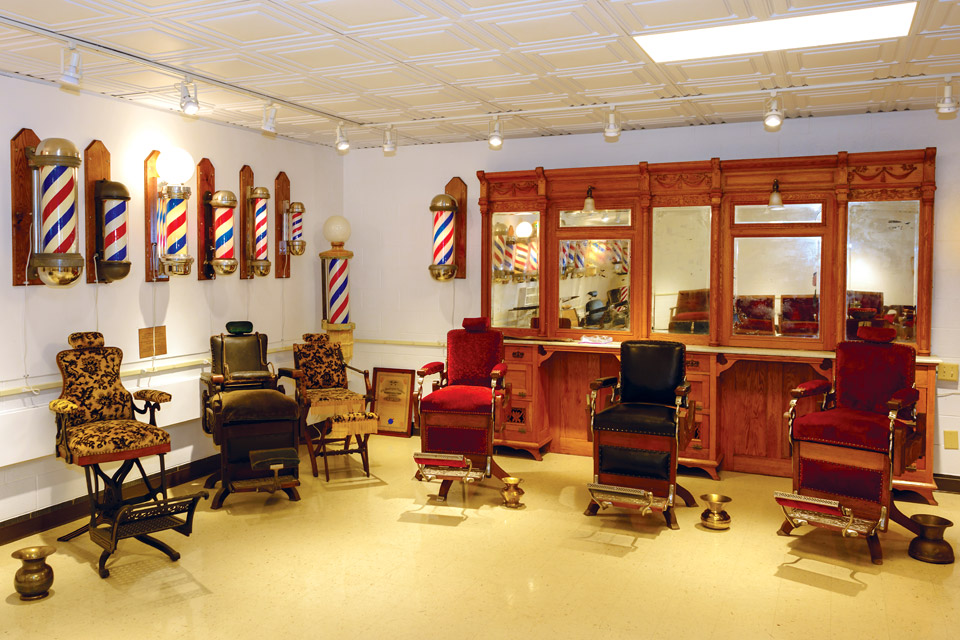 barber chairs and mirrors inside of the national barber museum