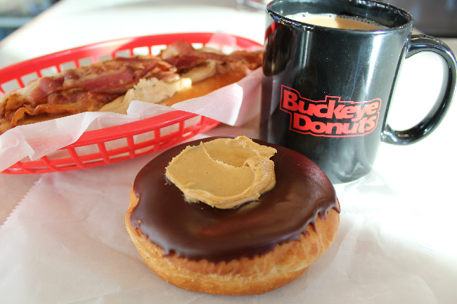 chocolate glazed donut with Buckeye Donuts coffee mug